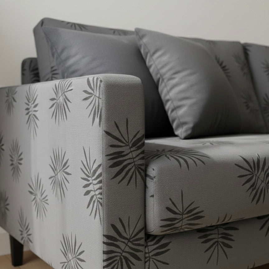 Gray sofa with leaf pattern in a minimalistic room